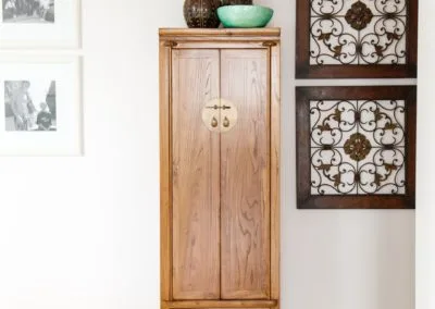 A tall slim cabinet used as modern Chinese living room storage