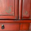 Close up of Chinese antique red butterfly cabinet