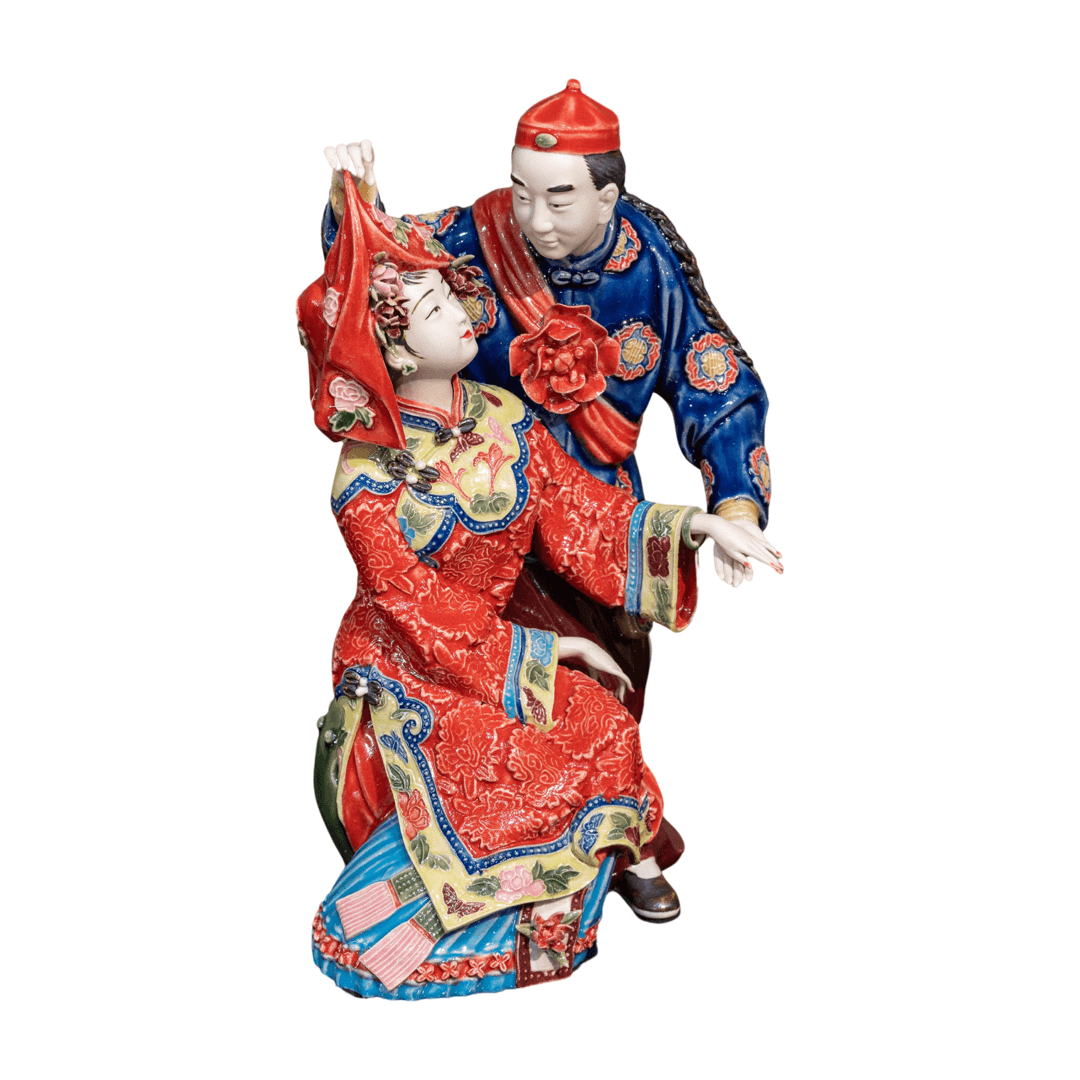 Chinese ceramic figurine of newly weds