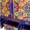 hand-painted tibetan-style cabinet in yellow & navy blue close up