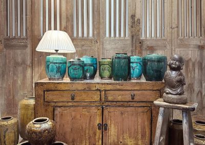Chinese antique furniture and old ceramic pots in mustard and green