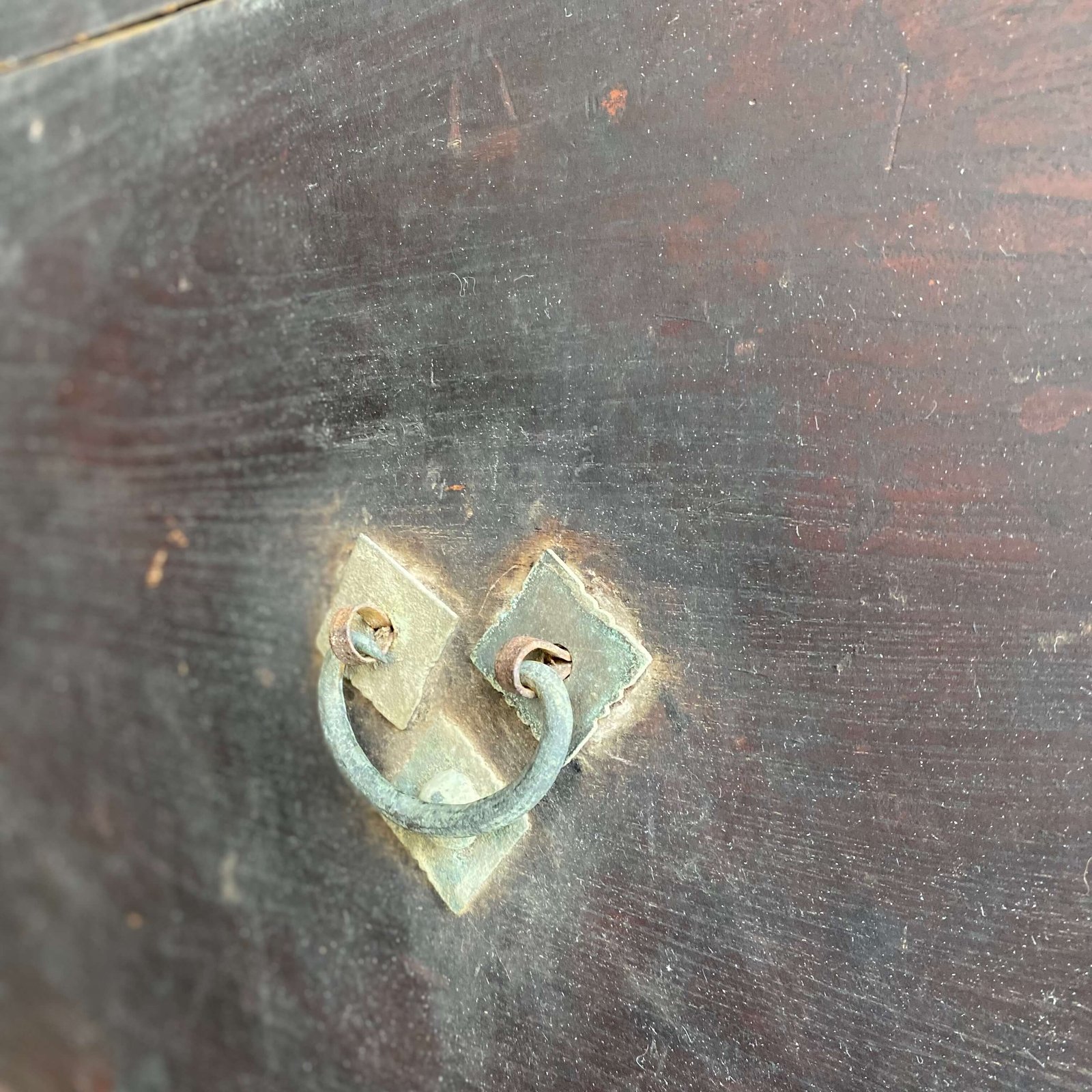 Close up of brass handles on chinese antique chest