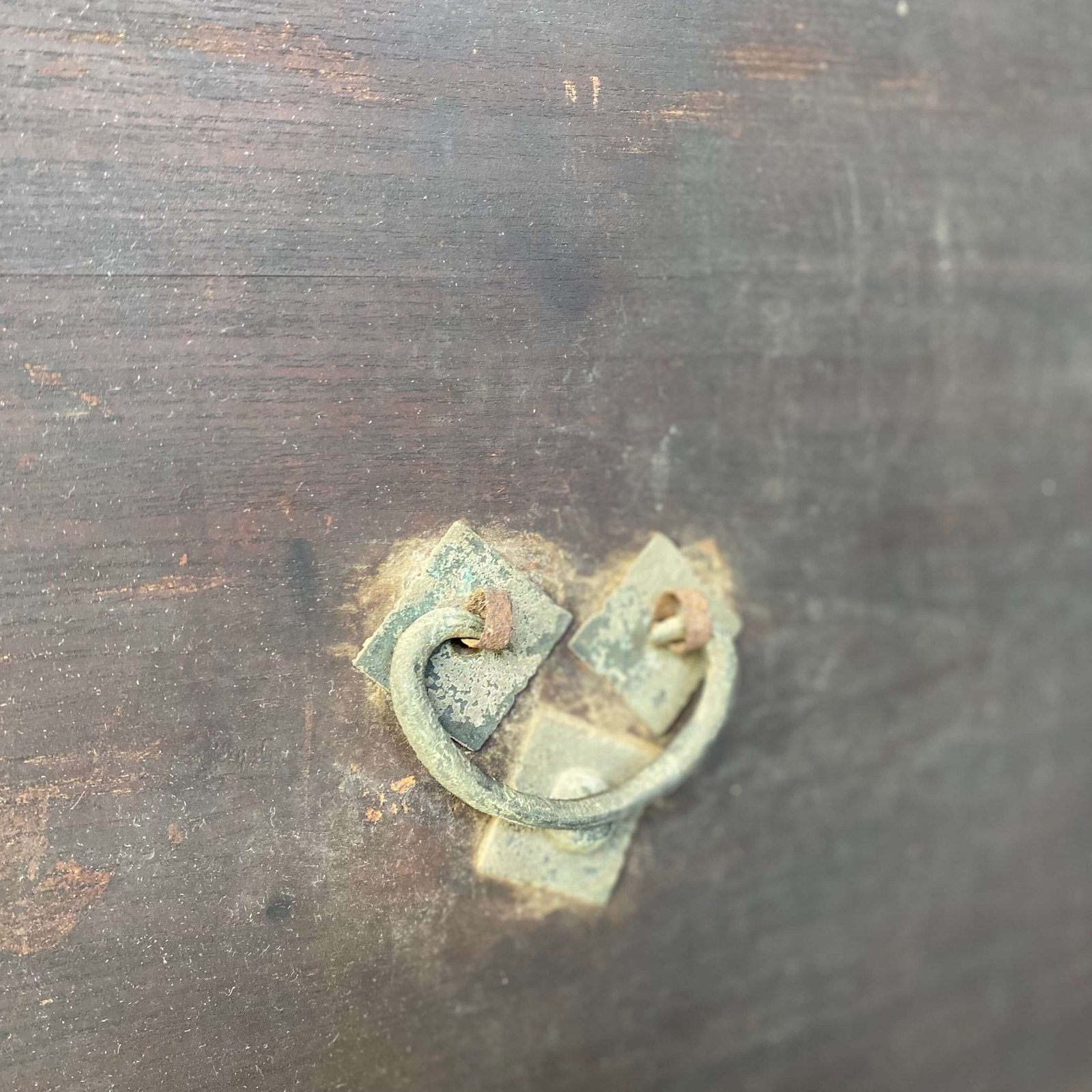 Close up of brass handles on chinese antique chest