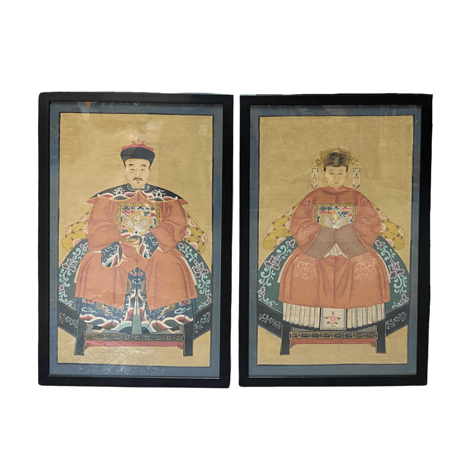 a pair of chinese hand-painted ancestral portraits in mandarin orange robes