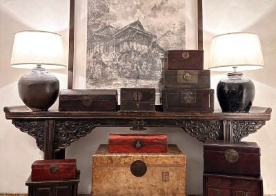 Chinese antique furniture, long carved table, old pot table lamps and leather boxes