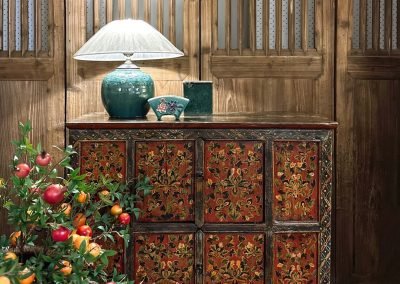 Antique Tibetan cabinet in painting of red, green & orange