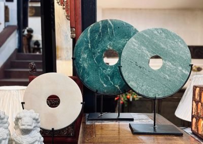 Round stone discs in green & white on black stands