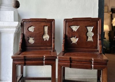 A pair of chinese antique screen chairs with cutout of shapes in vases and fruits at the back, from Shanghai
