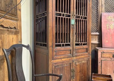 Chinese antique tall Shanghai cabinet with spindle doors & sides