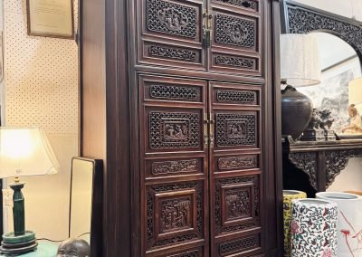 Tapered cabinet with Chinese antique carvings