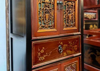Chinese antique Fujian carvings repurposed to a slim black, red & gold cabinet