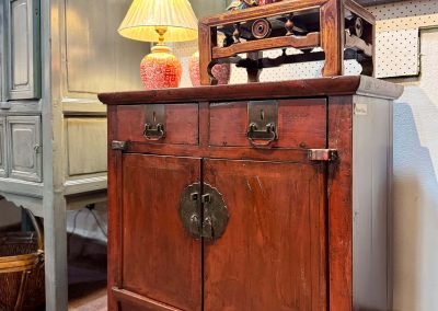 A small vintage chinese red cabinet with beautiful original red colour and patina