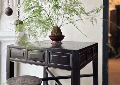 A vintage foldable black square chinese table for chess and games