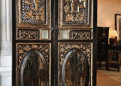 Chinese antique doors from Chaozhou, lacquered in black with gold leaf on the carvings. The carvings are impressive, it has a layered design