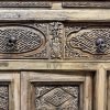 Close up of the beautiful relief carvings on the antique Chinese sideboard