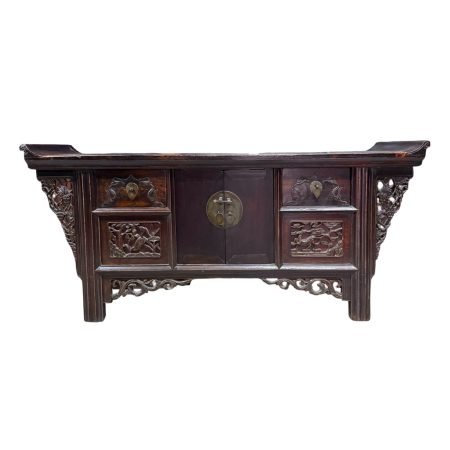 Antique Chinese low small sideboard with everted flanges and carved crane and deer panels